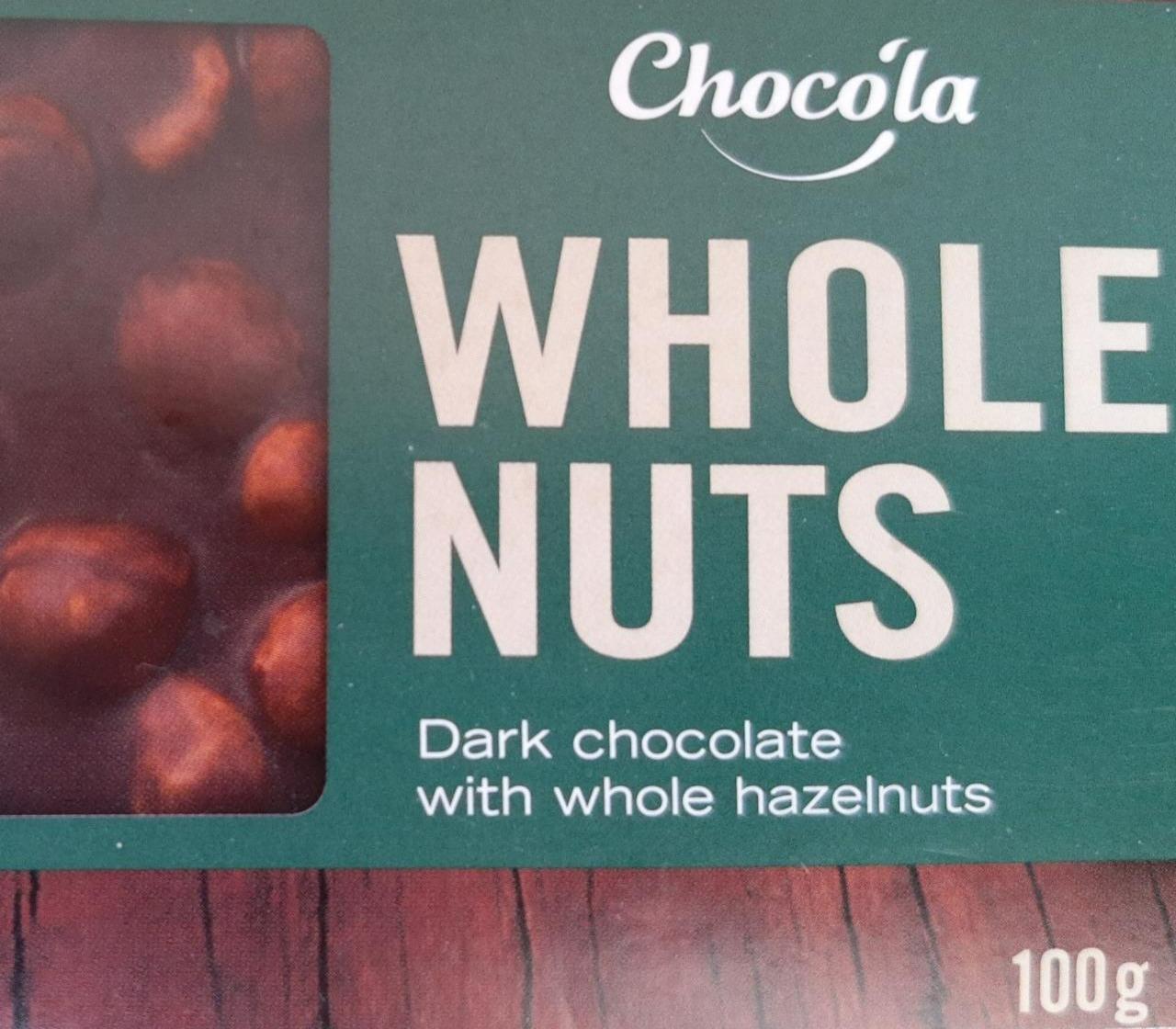 Fotografie - Dark chocolate with whole hazelnuts Chocola