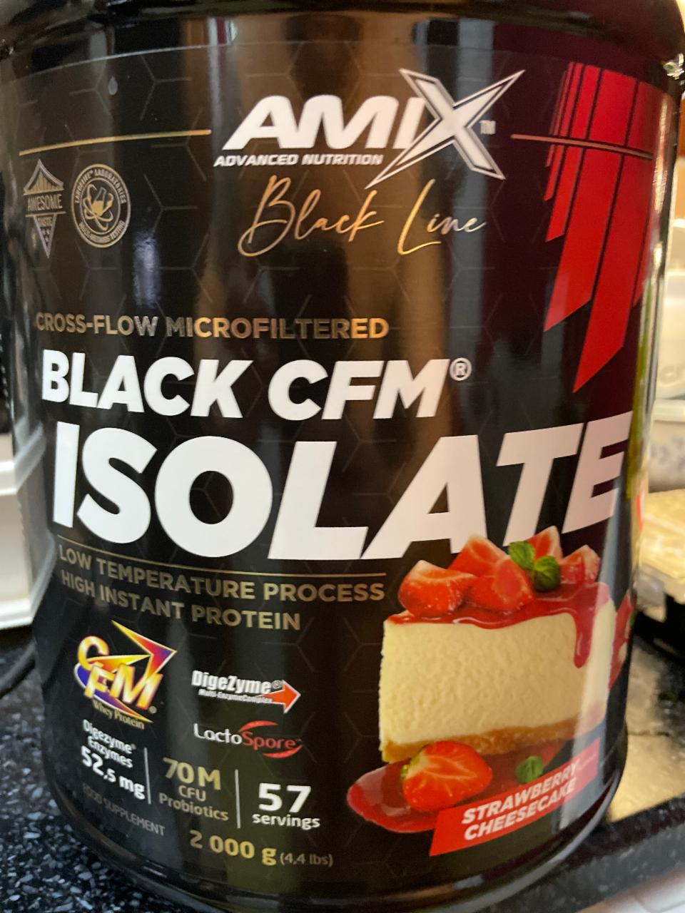 Fotografie - BLACK CFM ISOLATE high instant protein Strawberry cheesecake Amix Nutrition