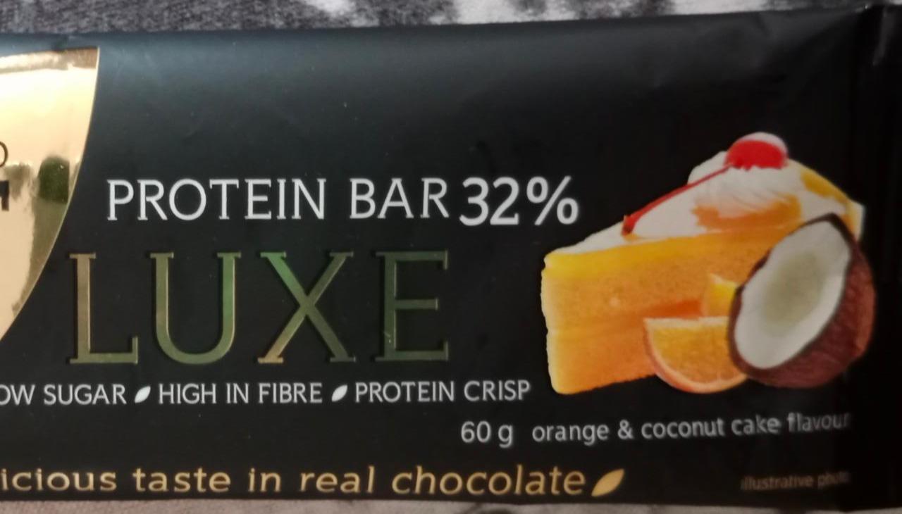 Fotografie - Deluxe protein bar 32% orange & coconut cake (pomerančovo-kokosový koláč v mléčné čokoládě) Nutrend