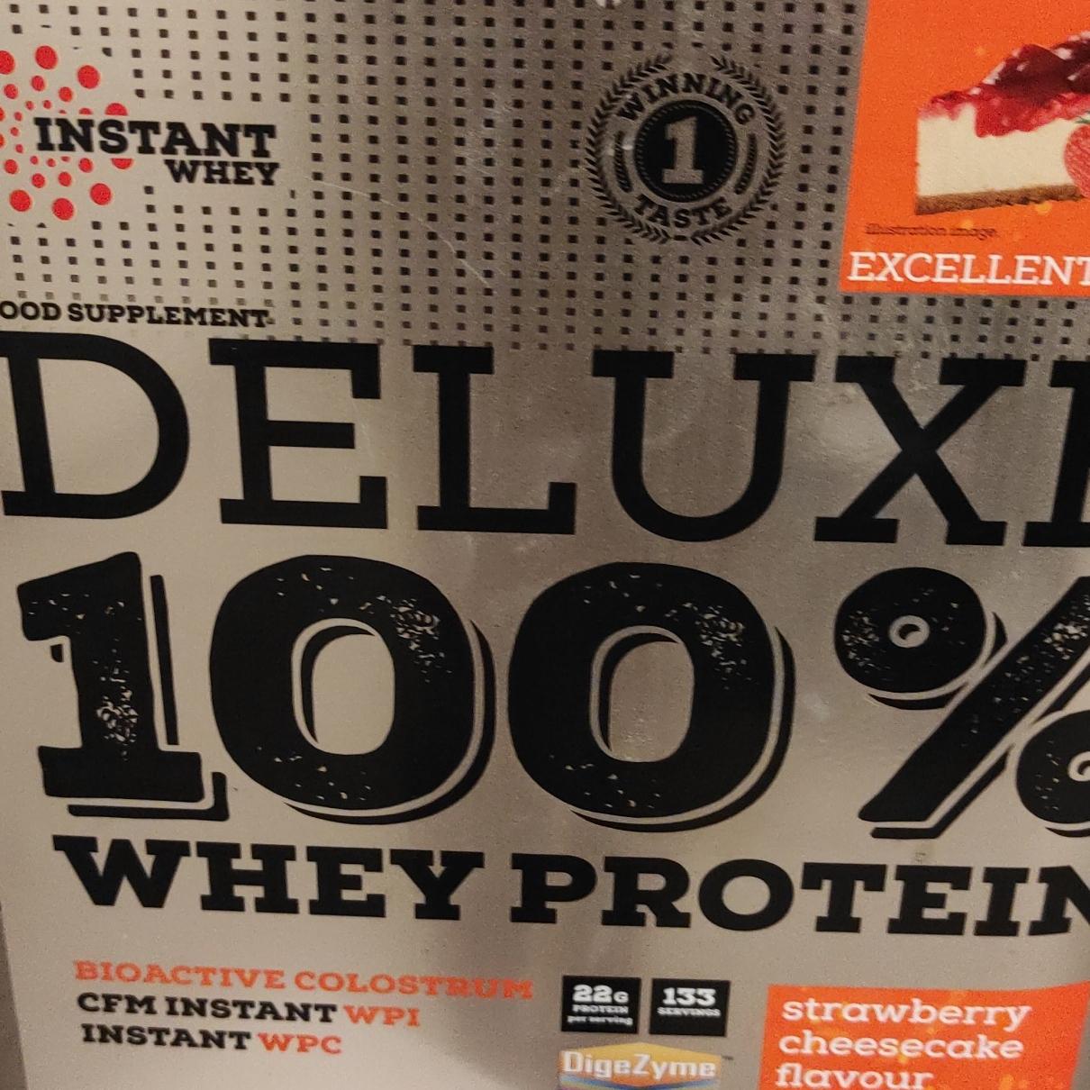 Fotografie - Deluxe 100% Whey protein strawberry cheesecake (jahodový cheesecake) Nutrend