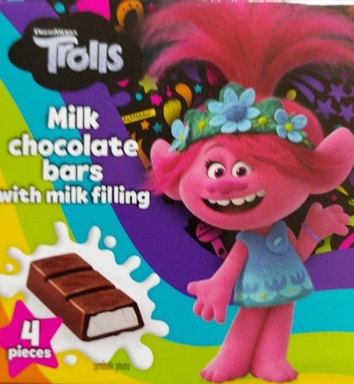 Fotografie - Milk chocolate bars with milk falling 