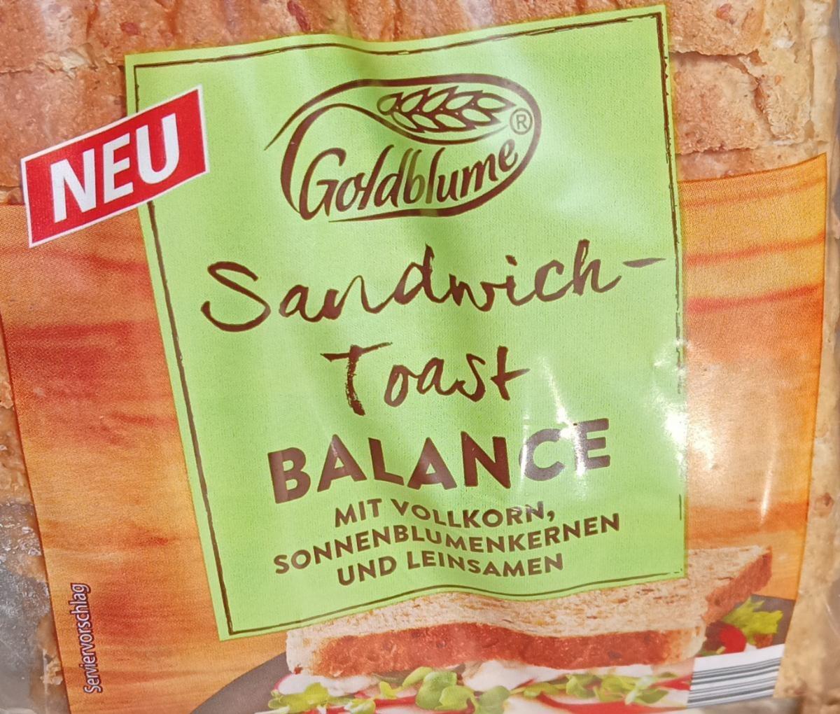 Fotografie - Sandwich toast balance Goldblume