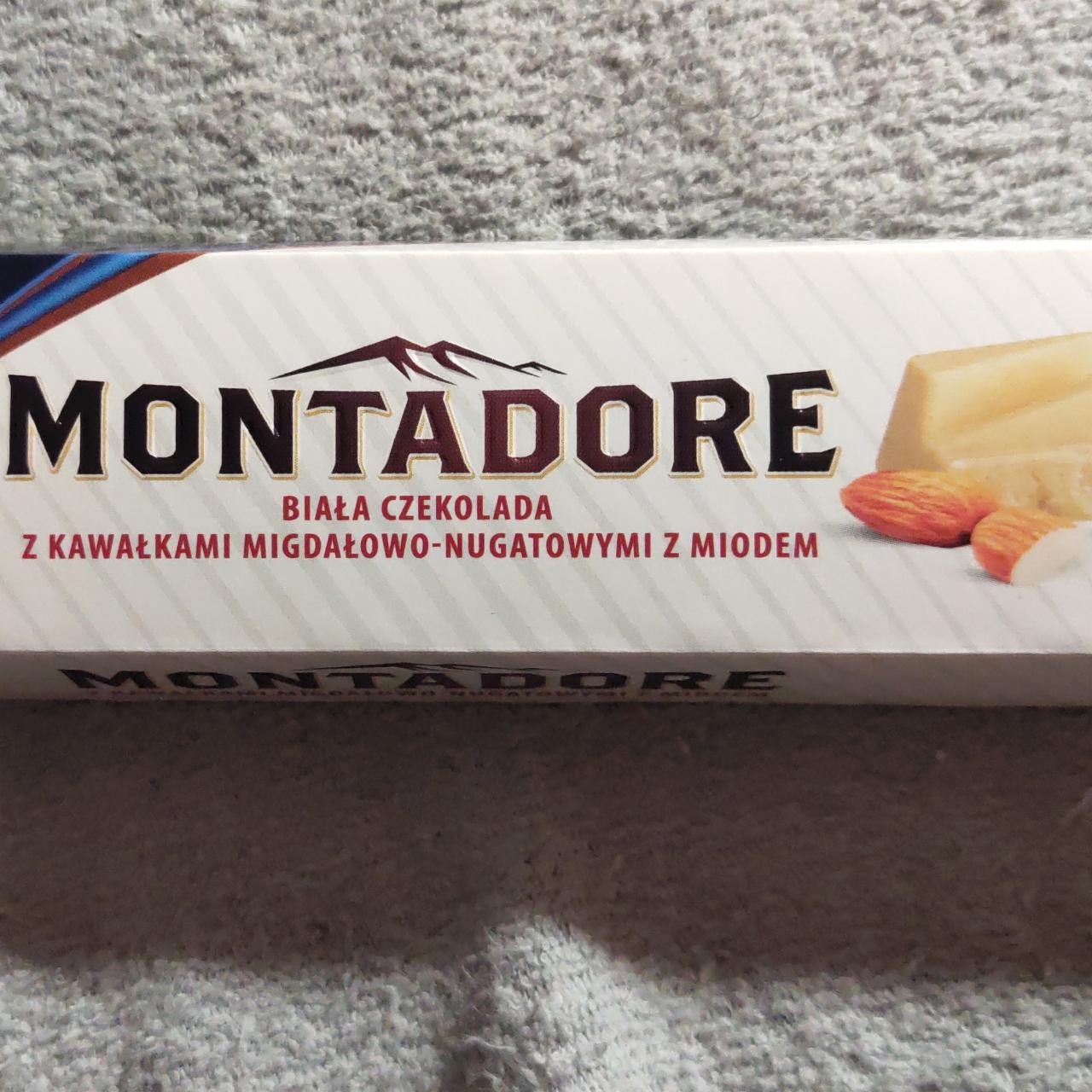Fotografie - Biała czekolada z kawalkami migdalowo-nugatowymi z miodem Montadore